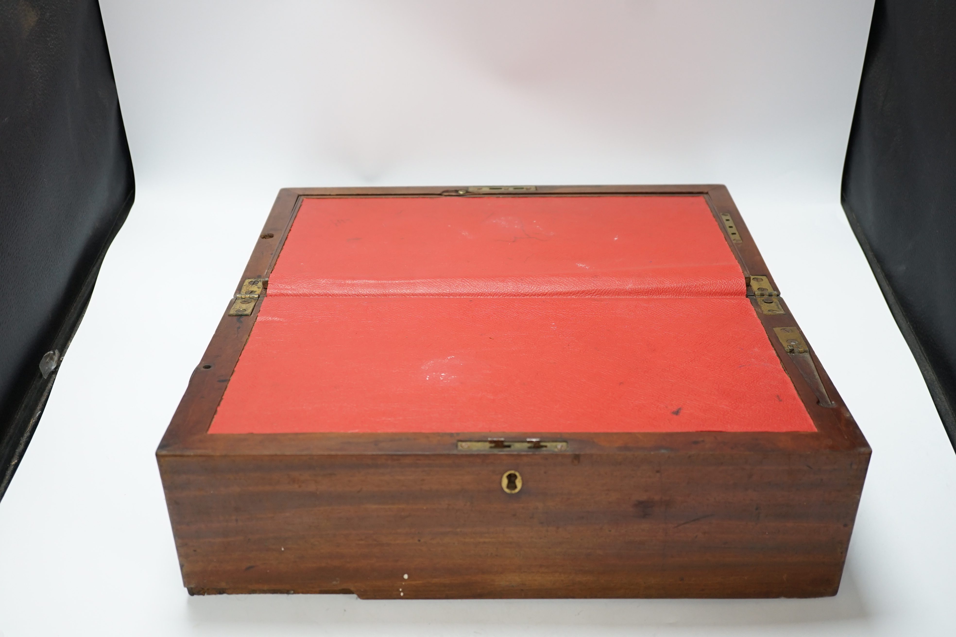 A Georgian writing slope with brass lock plate, 46cm